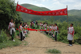 Miao people greeting Along's clients in a faraway Big Flower Miao village
