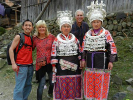 Along with his clients in a remote non-tourist Miao village